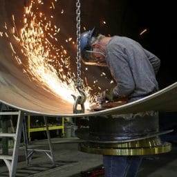 Man doing machine work without hearing protection