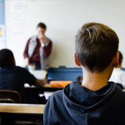 A teacher and students in a classroom.