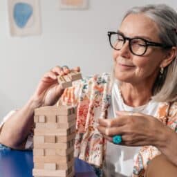 Senior woman putting together a puzzle.